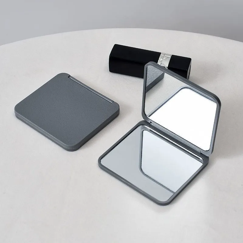 Travelfriendly doublesided folding compact mirror perfect for touchups